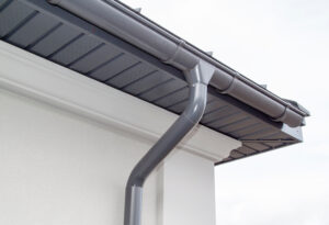 Gray seamless gutters on building